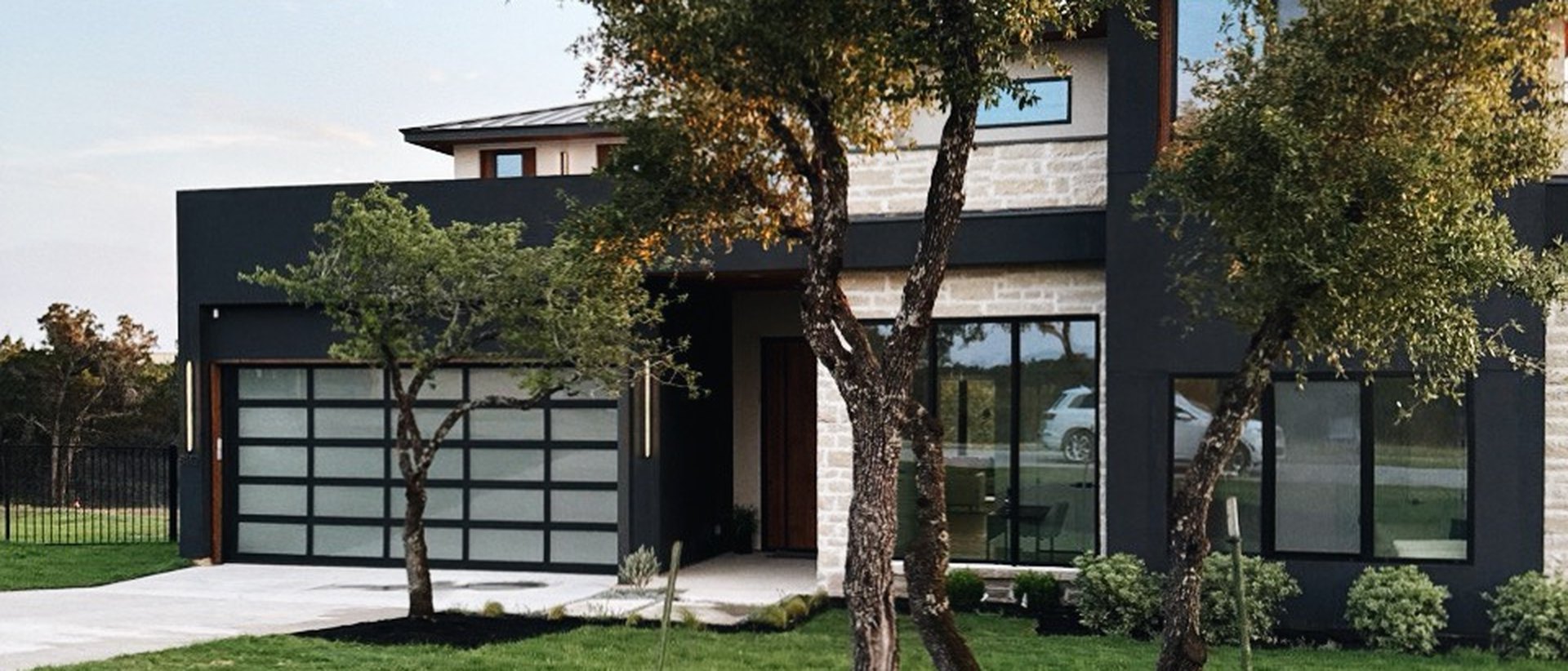 Oversized architectural glazing and sliding door system in a residence